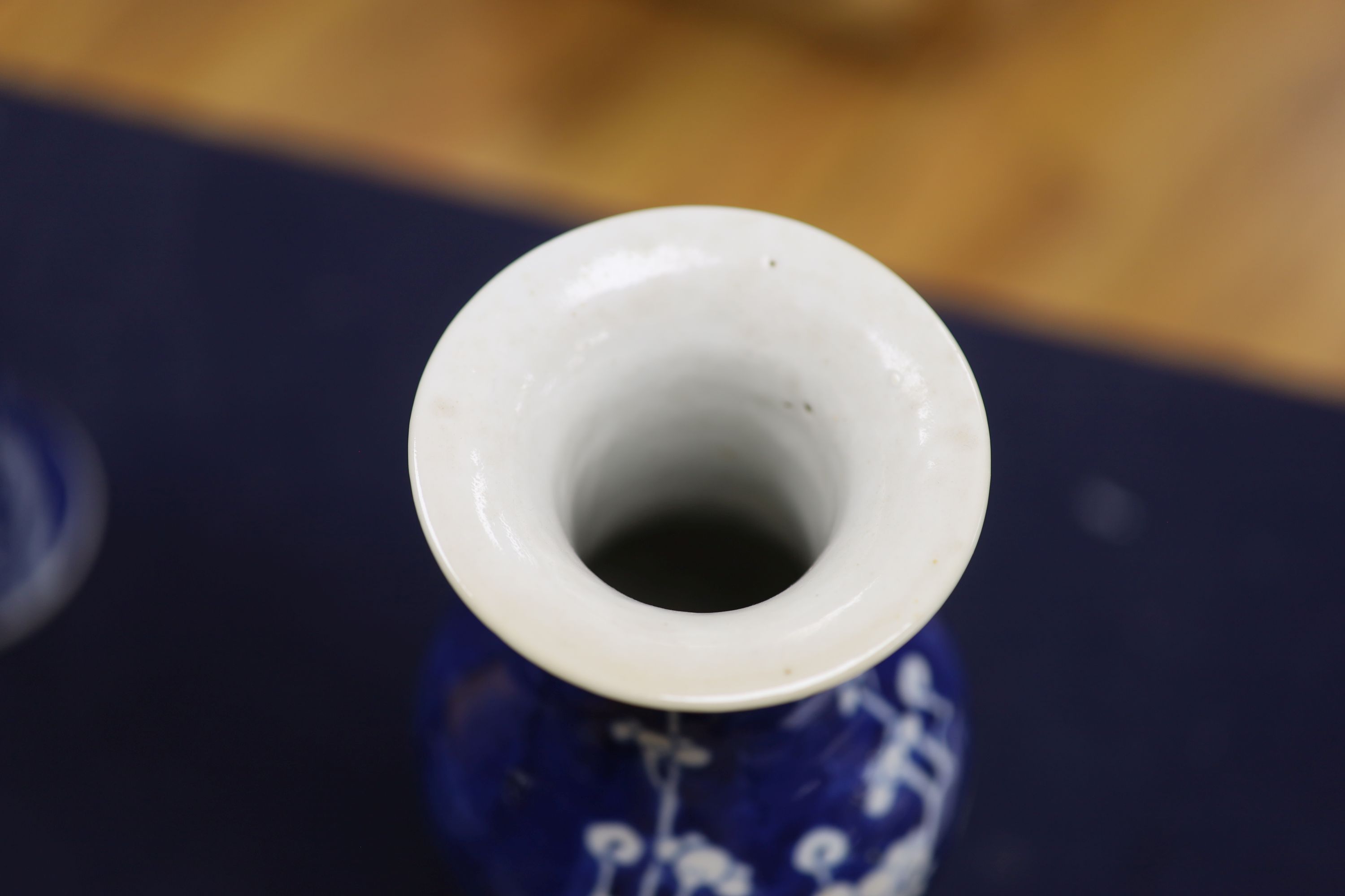 A pair of slender Chinese blue and white prunus vases, late 19th century, height 30cm